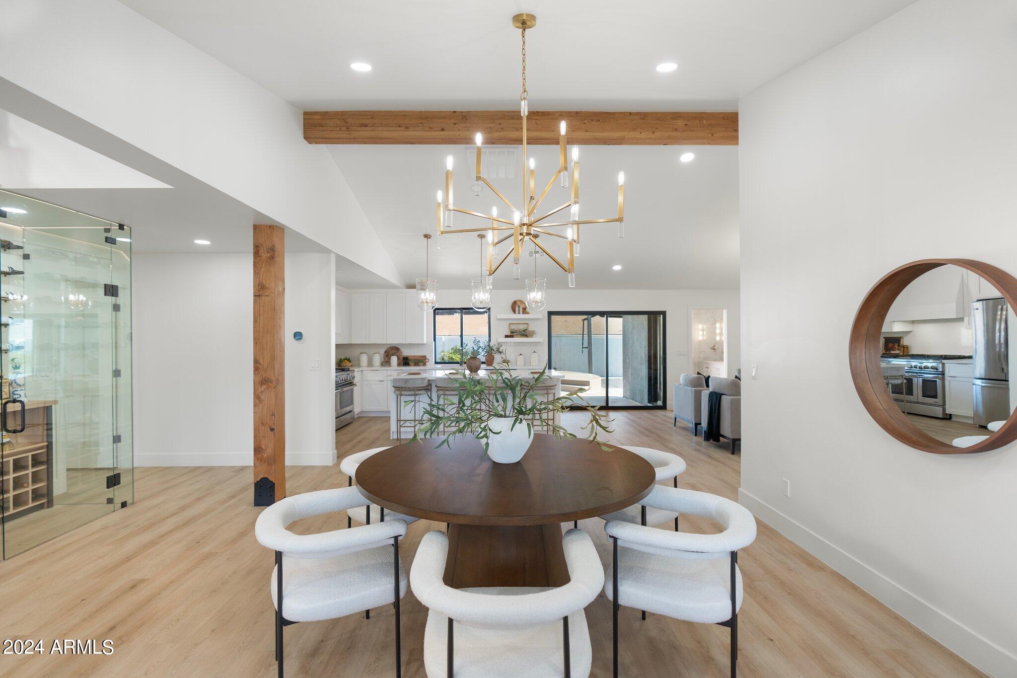 1643 West Griswold Road Phoenix, AZ 85021 - Photo 47 of 81 a view of a dining room with furniture and chandelier