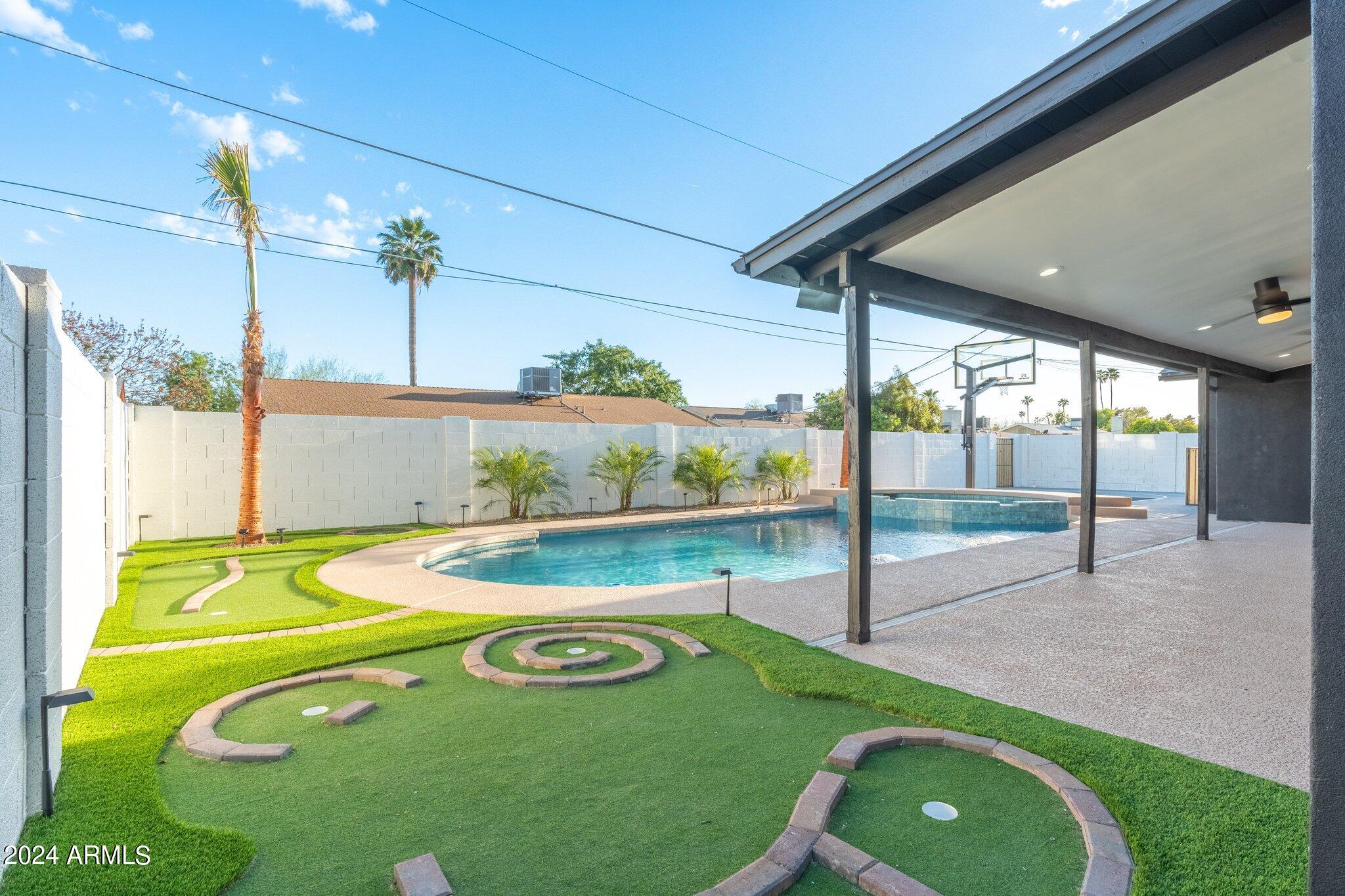 1643 West Griswold Road Phoenix, AZ 85021 - Photo 69 of 81 a view of a swimming pool with a patio