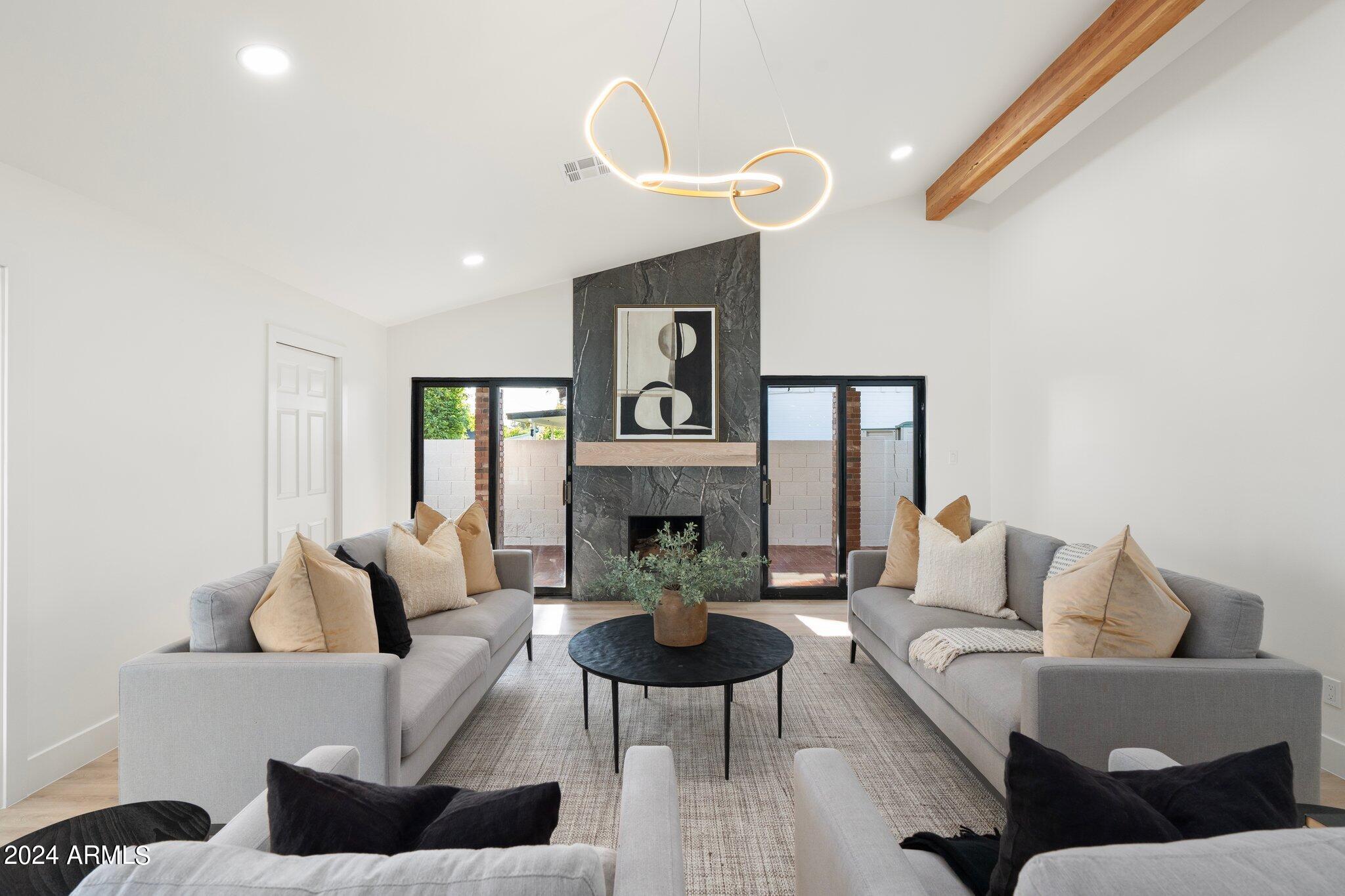 1643 West Griswold Road Phoenix, AZ 85021 - Photo 7 of 81 a living room with furniture and a fireplace