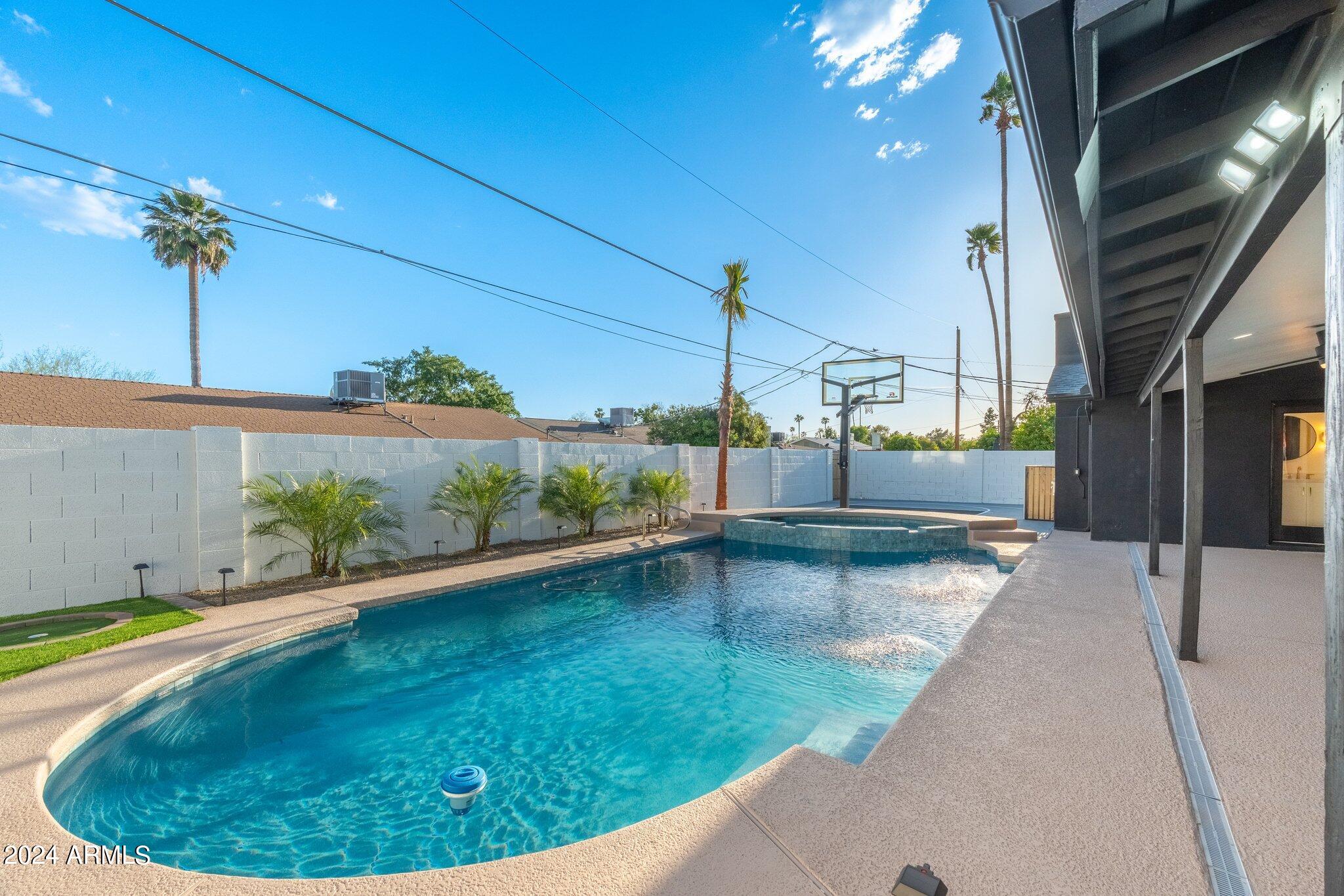 1643 West Griswold Road Phoenix, AZ 85021 - Photo 71 of 81 a view of a swimming pool with a patio