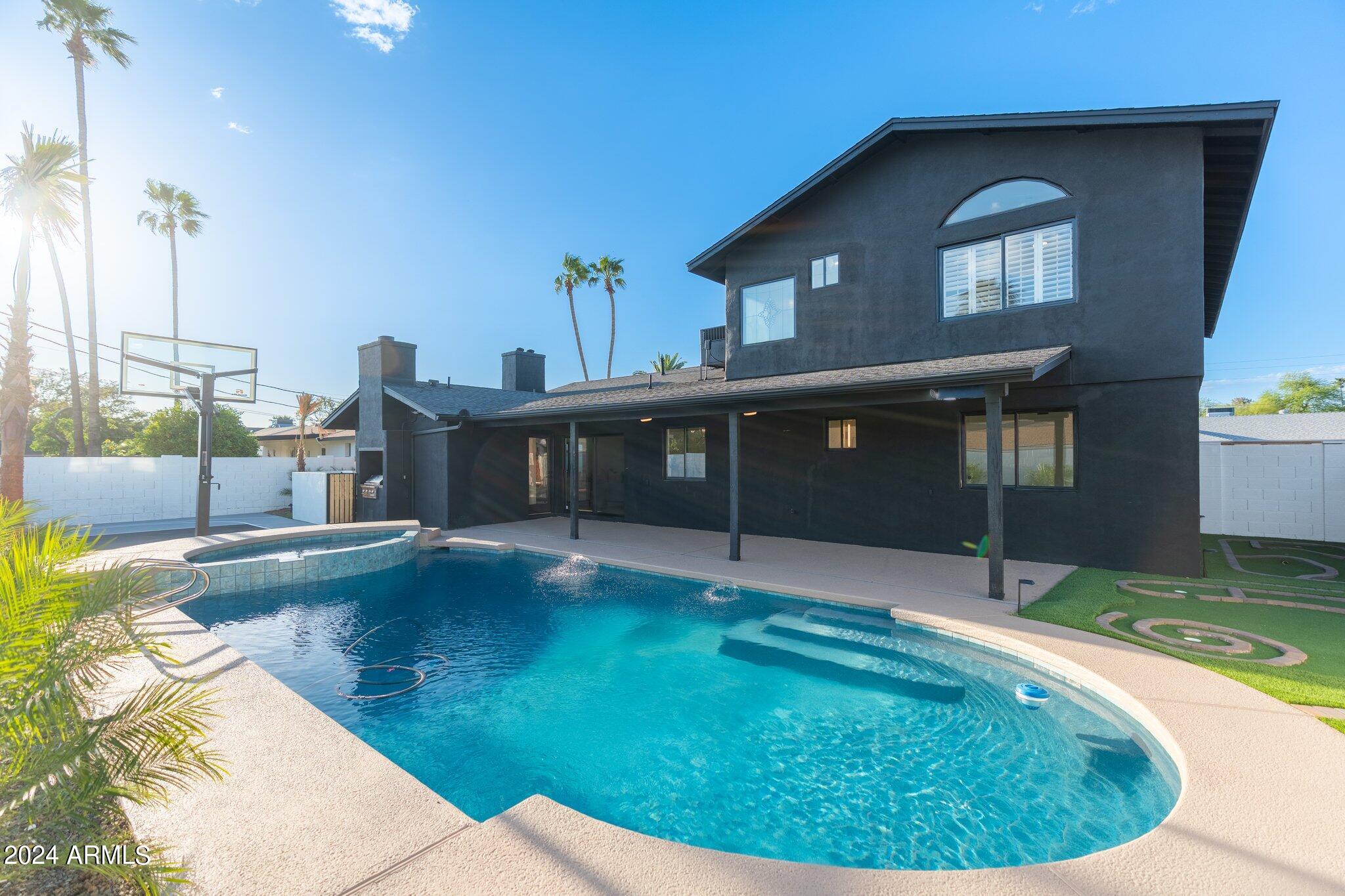 1643 West Griswold Road Phoenix, AZ 85021 - Photo 72 of 81 a house view with a swimming pool