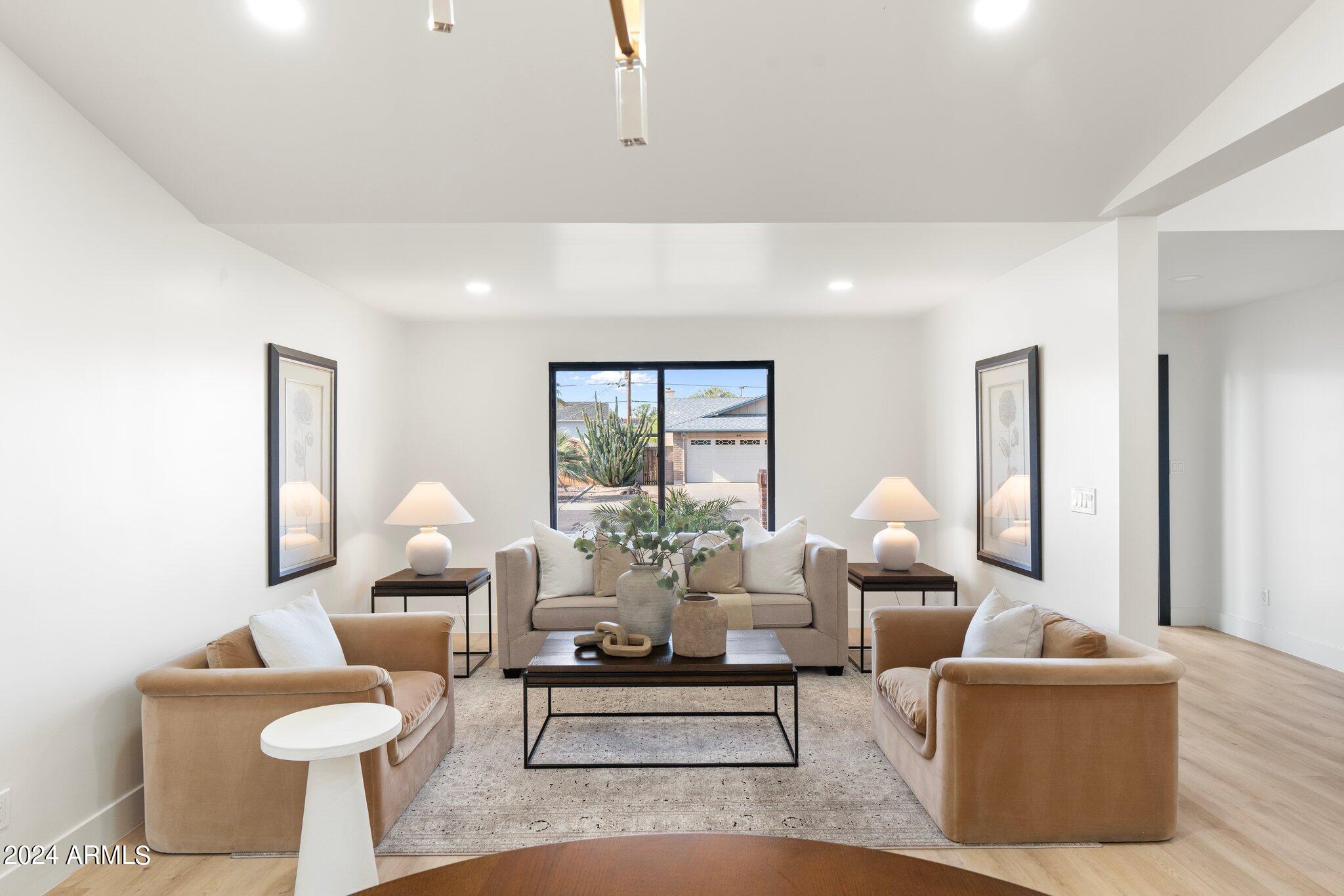 1643 West Griswold Road Phoenix, AZ 85021 - Photo 8 of 81 a living room with furniture and a large window