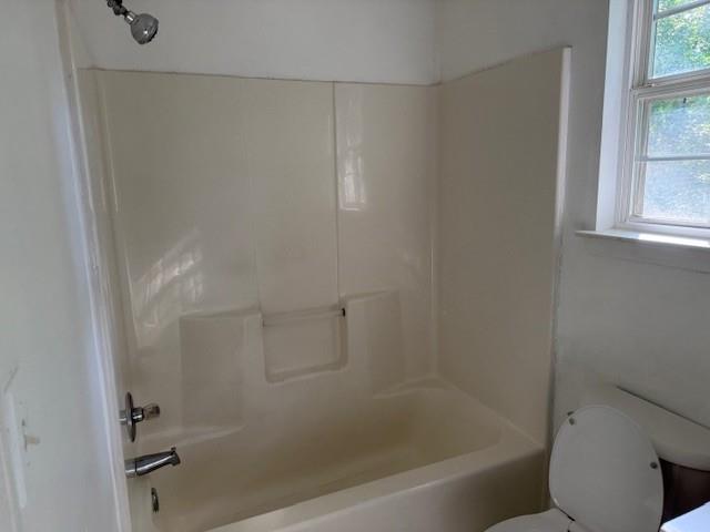 2196 Stenger Road Douglasville, GA 30135 - Photo 11 of 13 a bathroom with a bathtub and window
