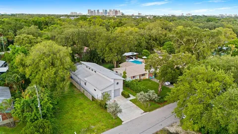 an aerial view of a house with a yard