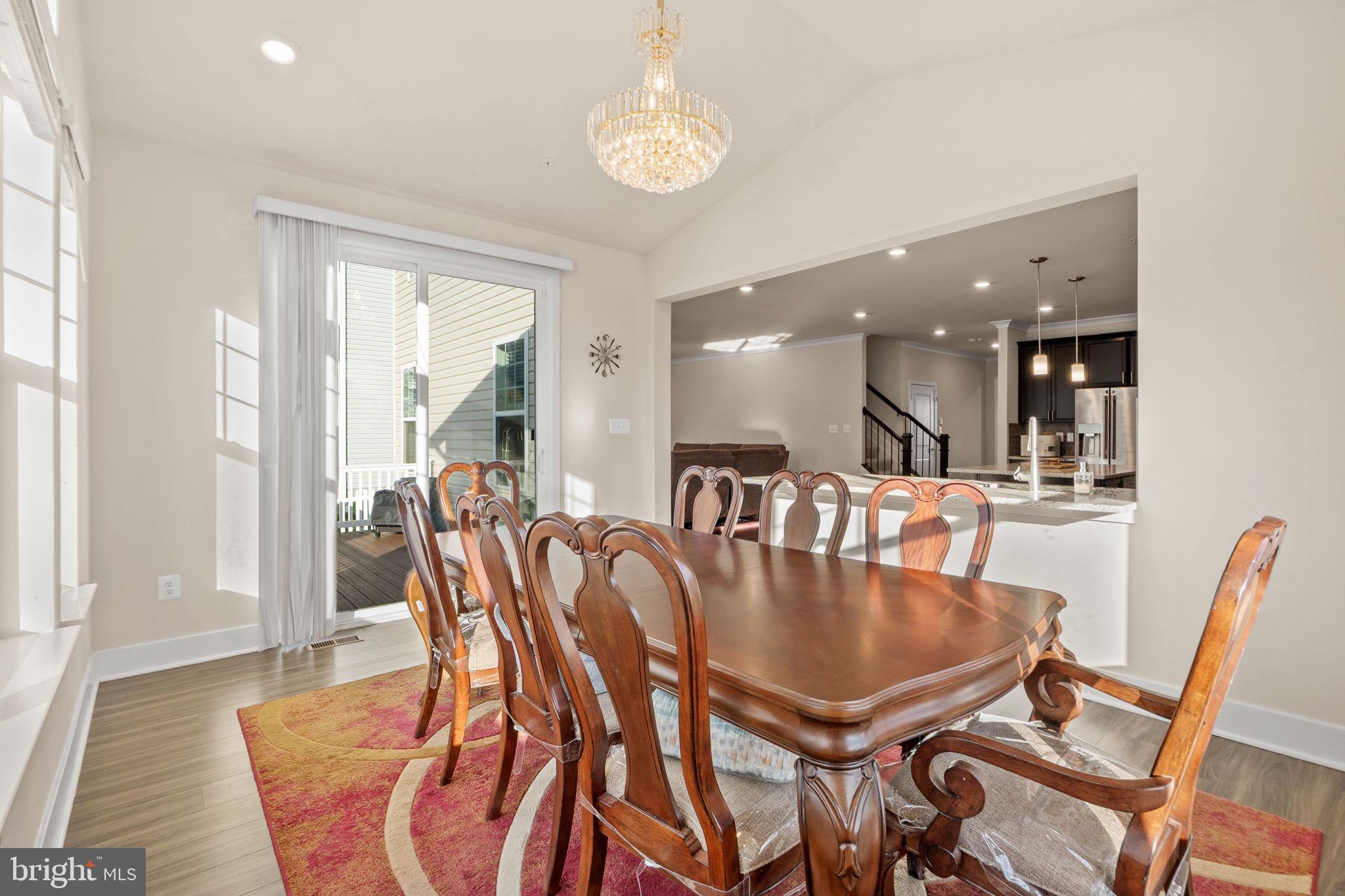 1281 Backbone Way Frederick, MD 21702 - Photo 11 of 40 a dining room with furniture and wooden floor