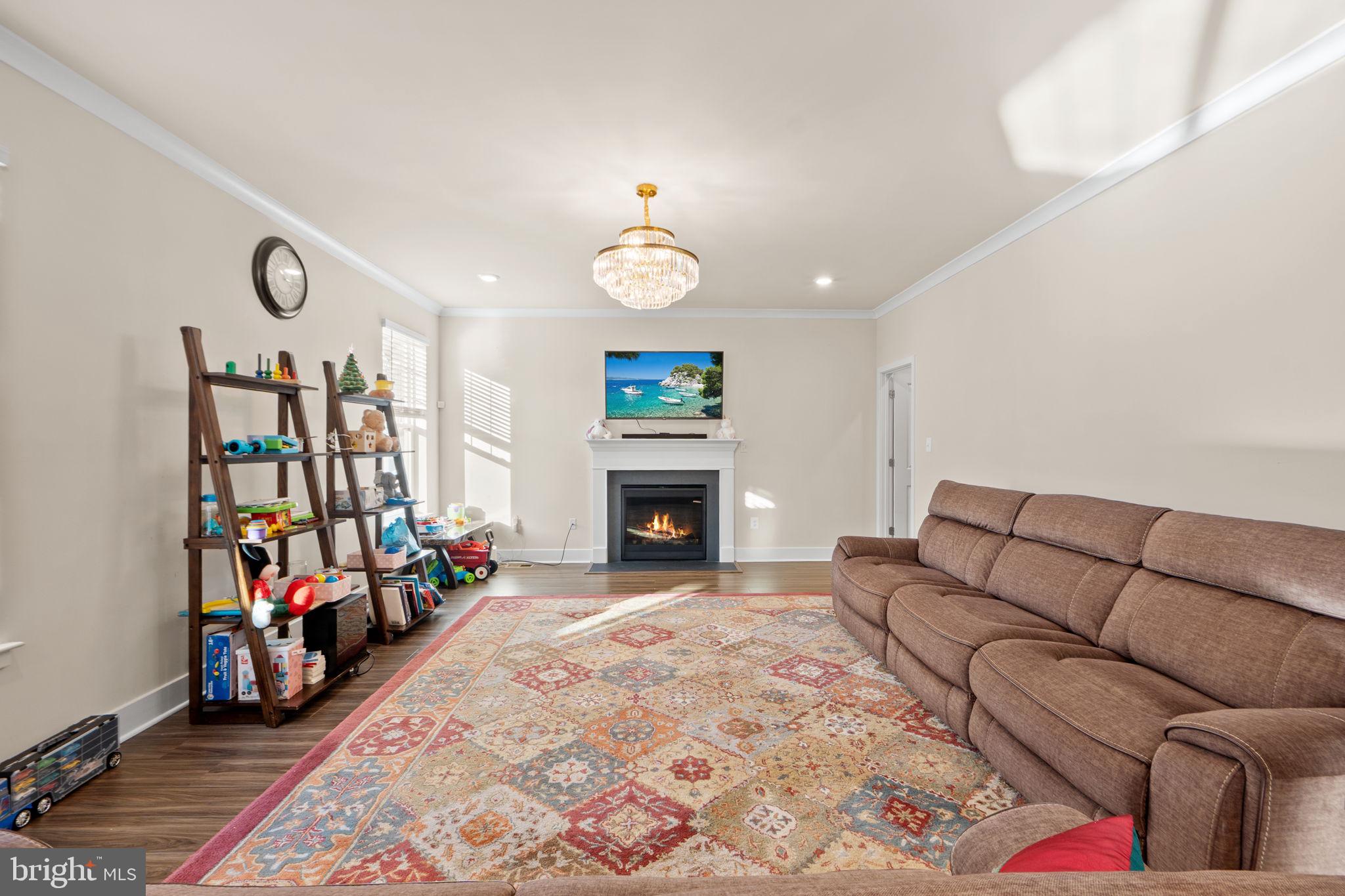 1281 Backbone Way Frederick, MD 21702 - Photo 14 of 40 a living room with furniture and a fireplace