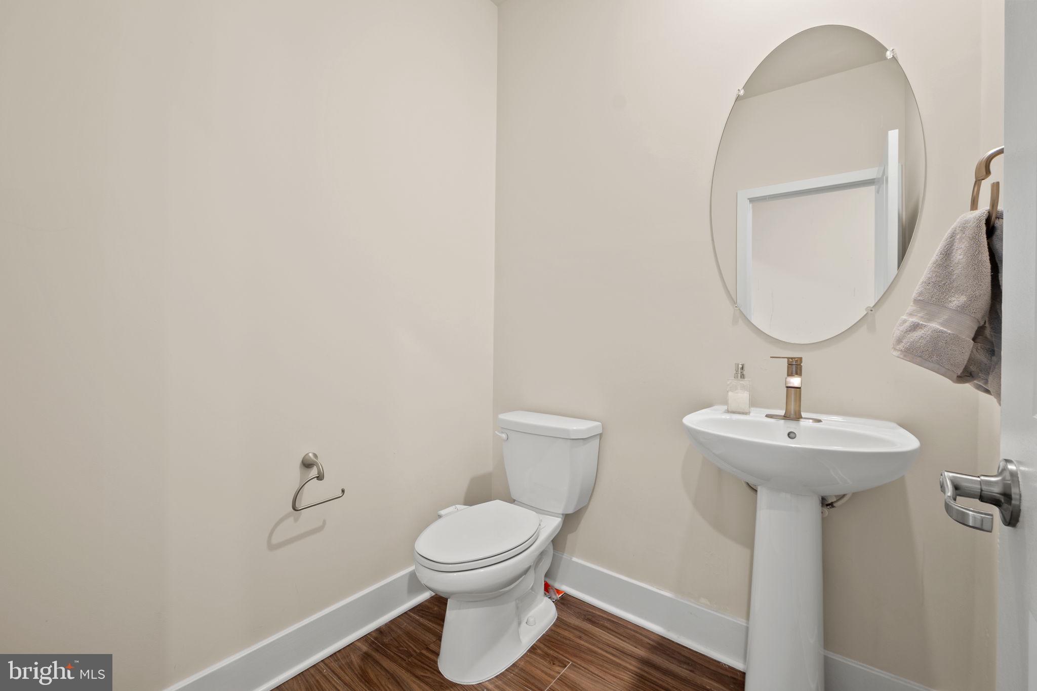 1281 Backbone Way Frederick, MD 21702 - Photo 16 of 40 a bathroom with a toilet sink and mirror