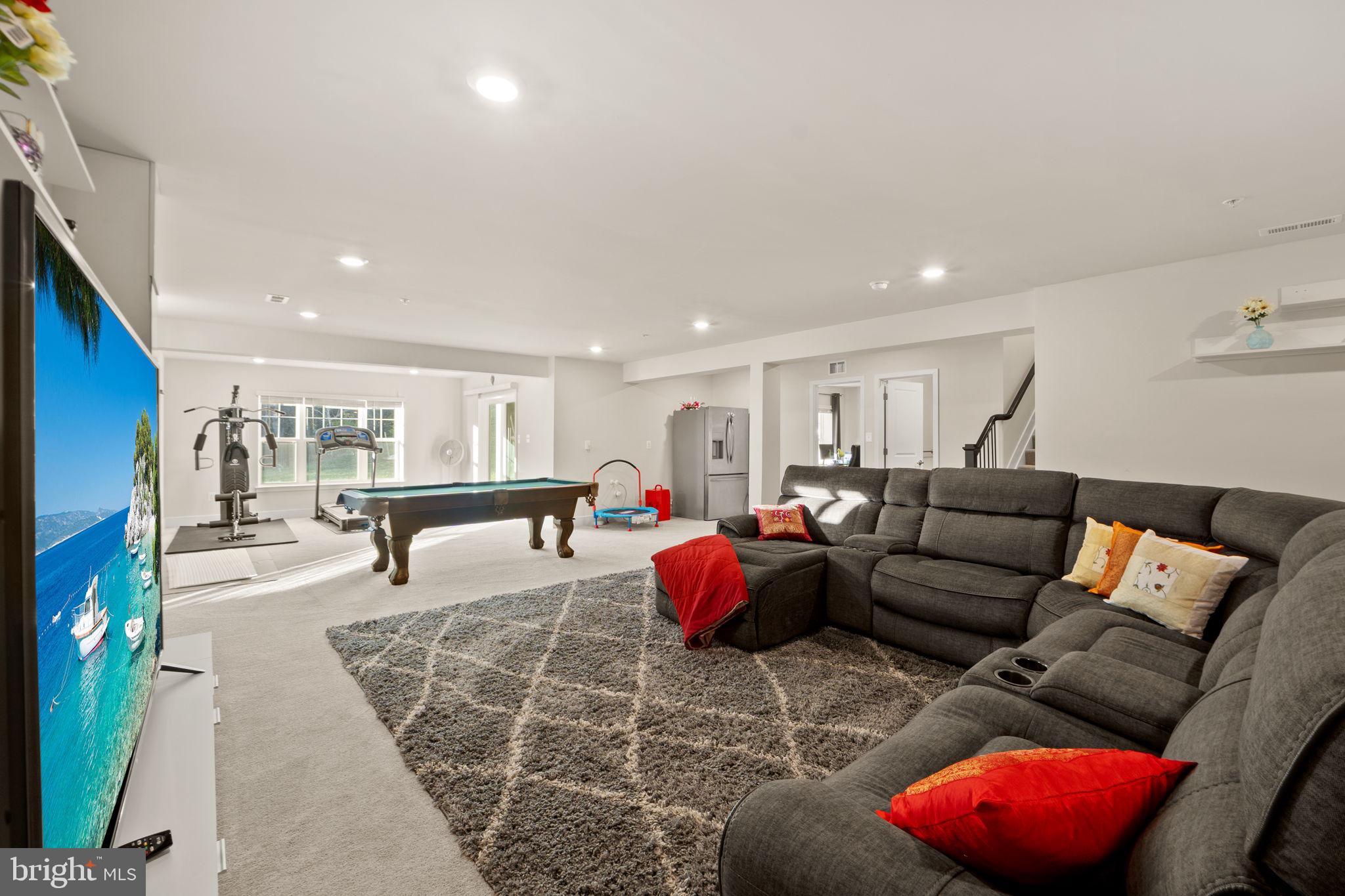 1281 Backbone Way Frederick, MD 21702 - Photo 32 of 40 a living room with furniture and kitchen view