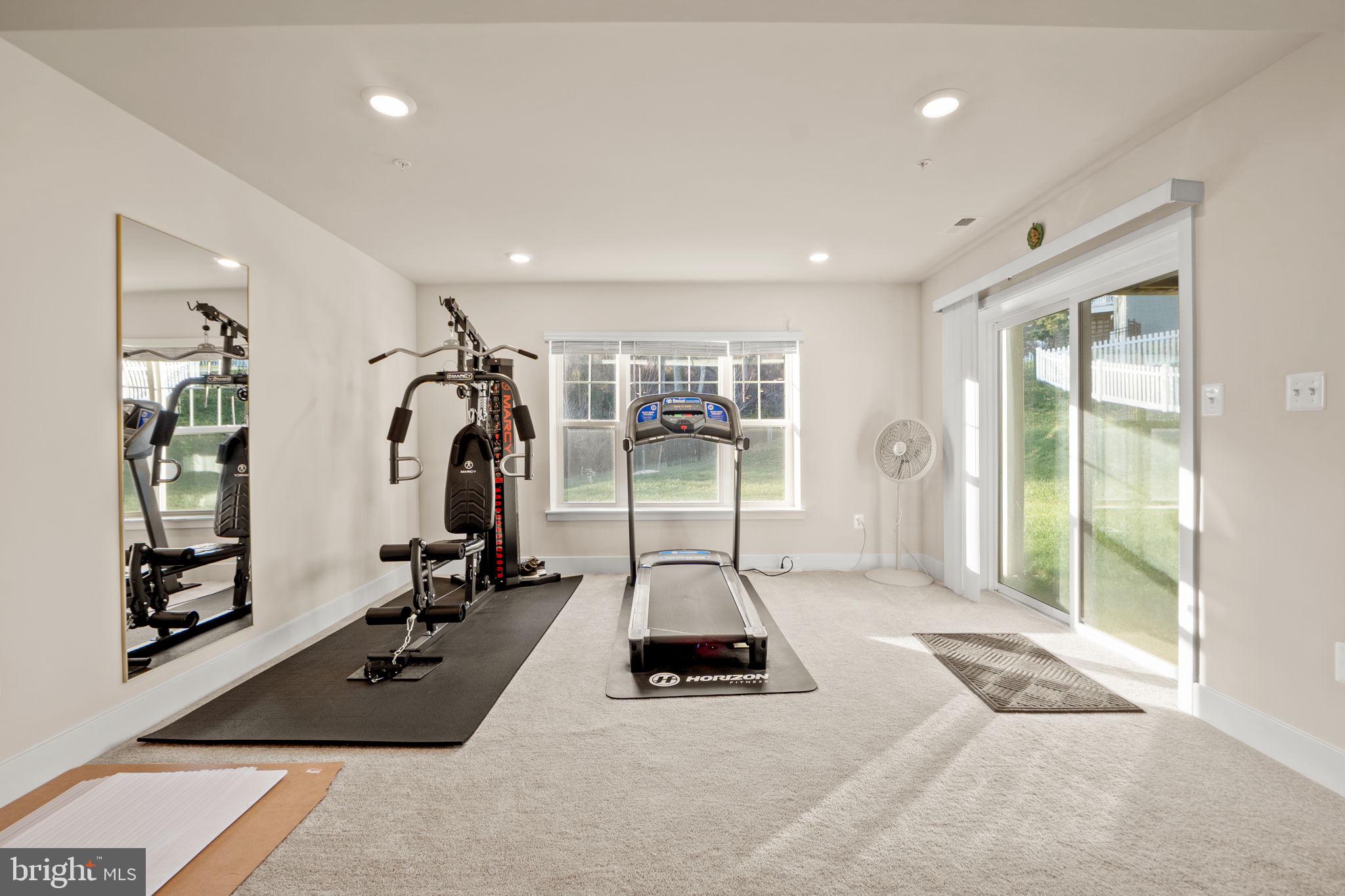 1281 Backbone Way Frederick, MD 21702 - Photo 35 of 40 a view of a room with gym equipment