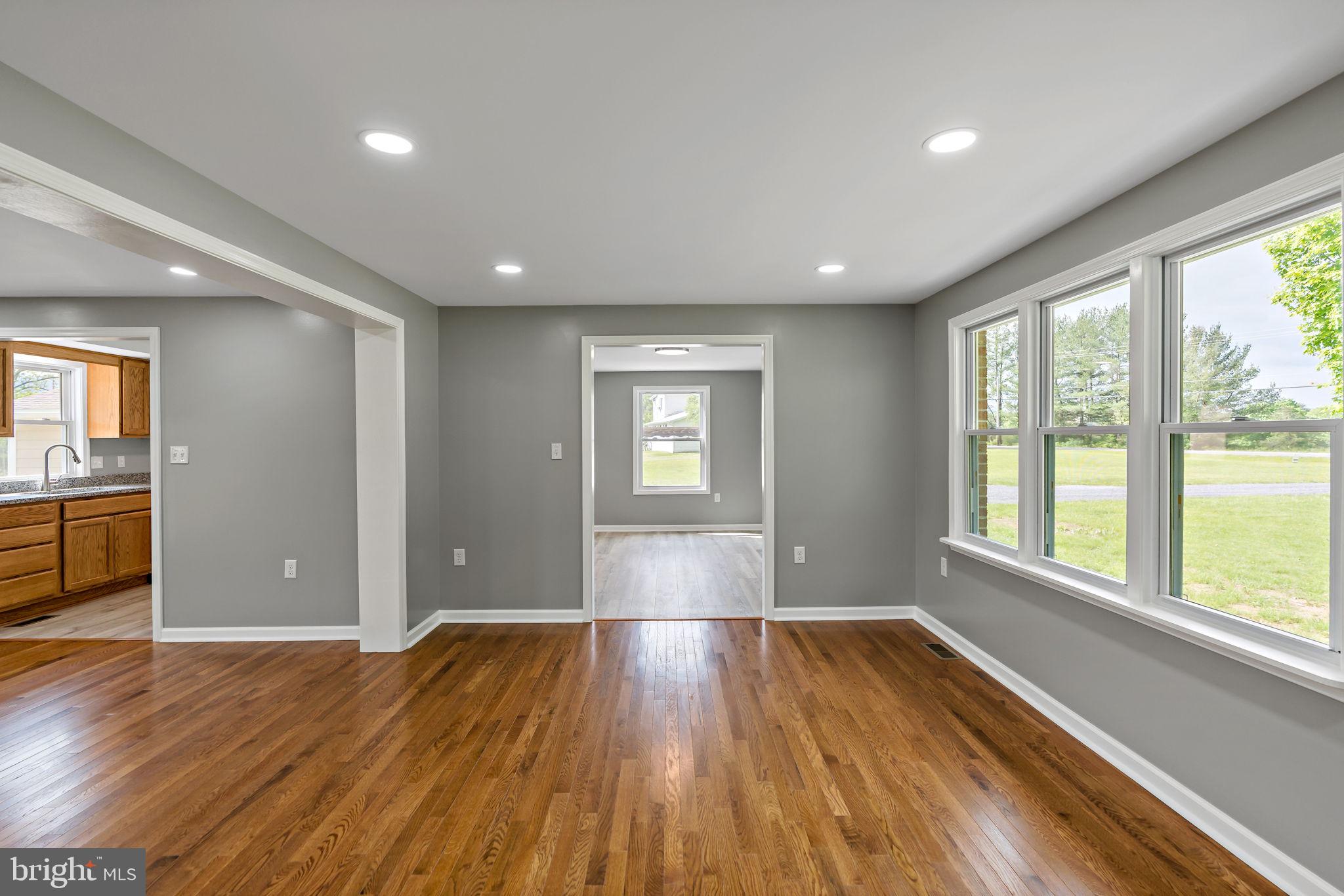 7021 Winchester Grade Road Berkeley Springs, WV 25411 - Photo 11 of 46 Living Room area looking into dining area