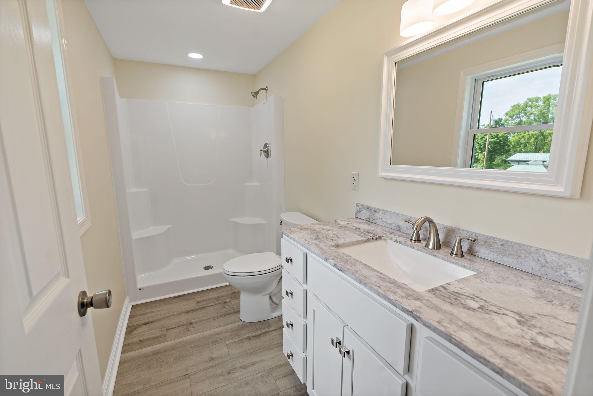 7021 Winchester Grade Road Berkeley Springs, WV 25411 - Photo 20 of 46 Main bedroom with double sinks and shower.