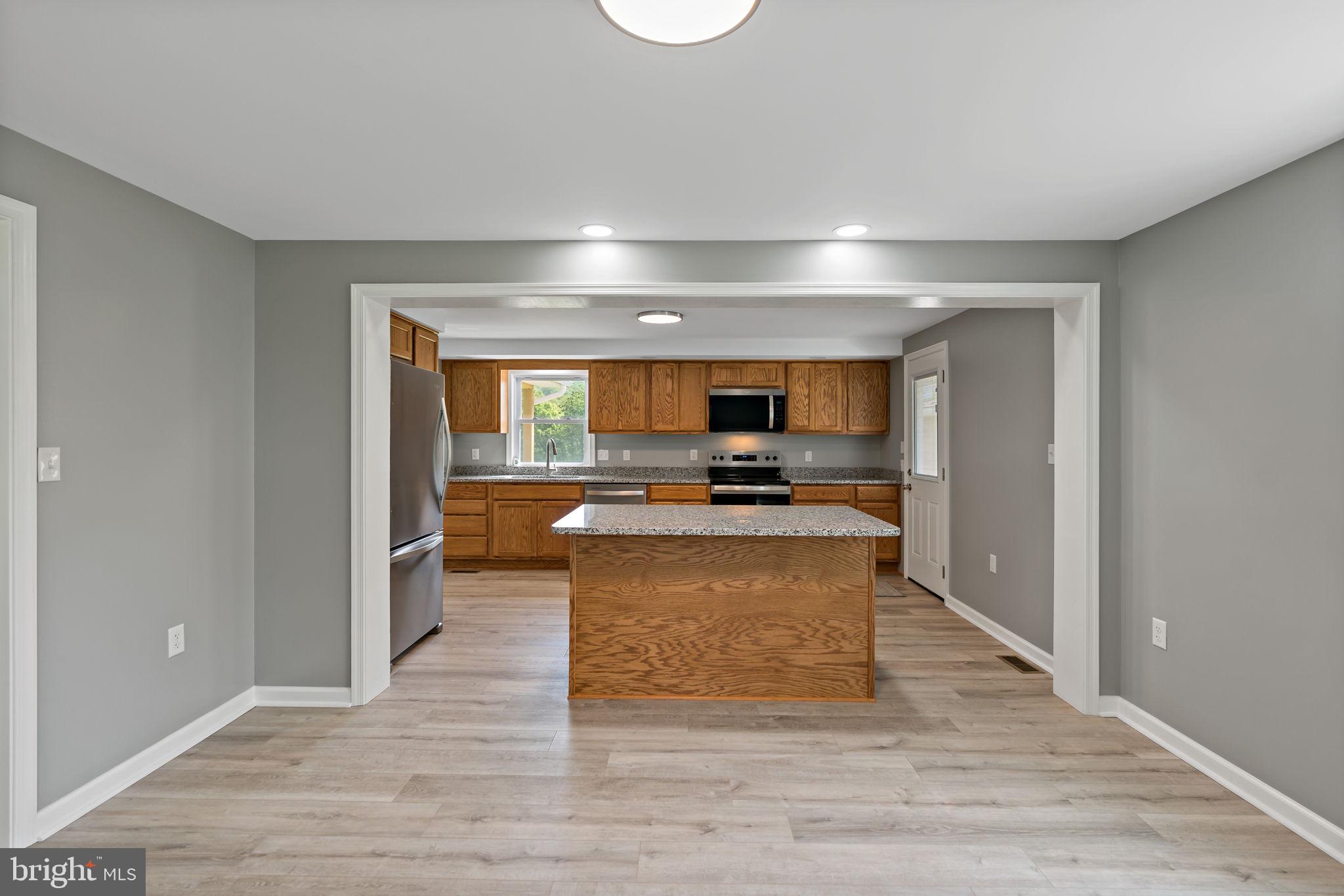 7021 Winchester Grade Road Berkeley Springs, WV 25411 - Photo 5 of 46 Dining area looking toward kitchen