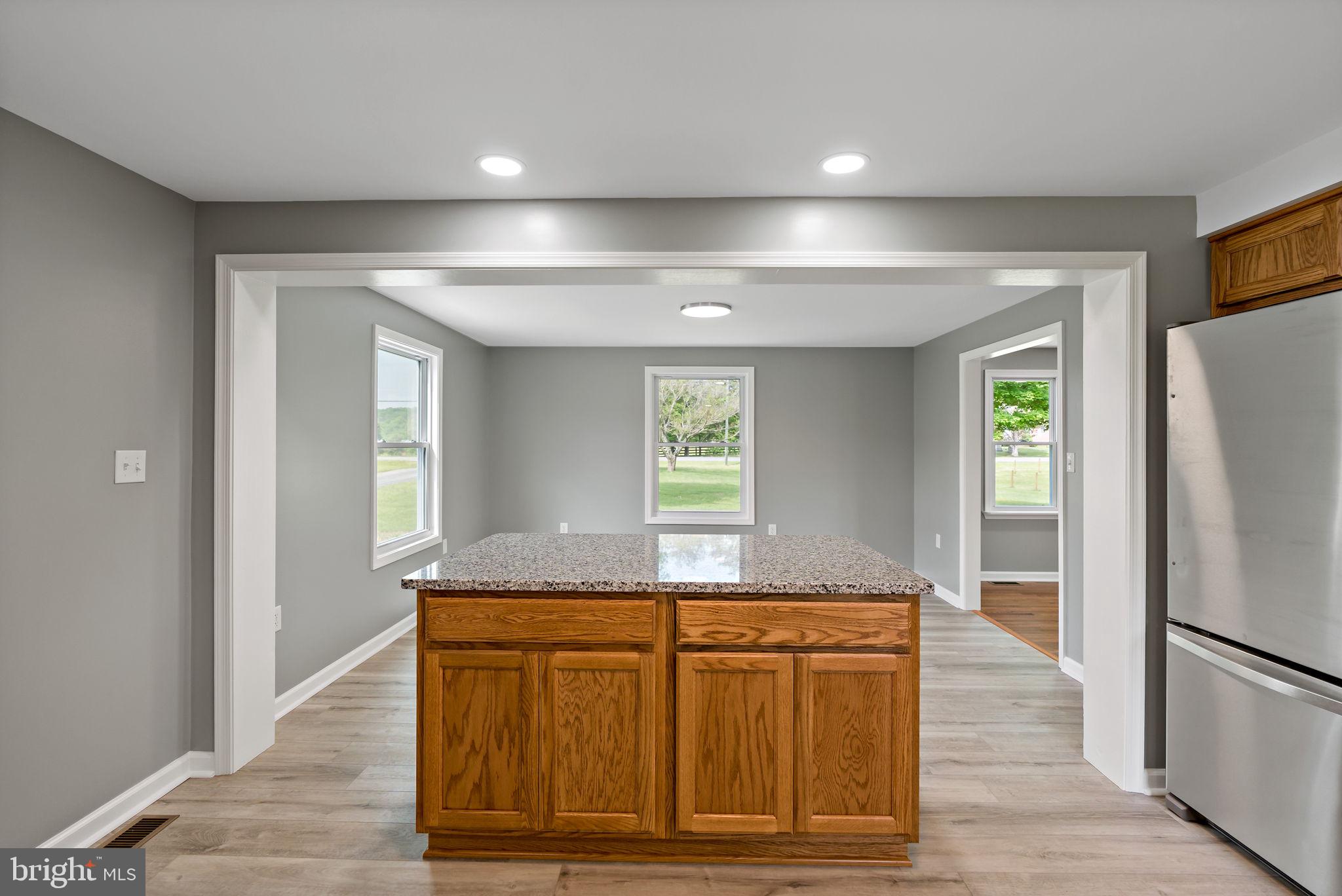 7021 Winchester Grade Road Berkeley Springs, WV 25411 - Photo 6 of 46 Large center island separate's from dining area