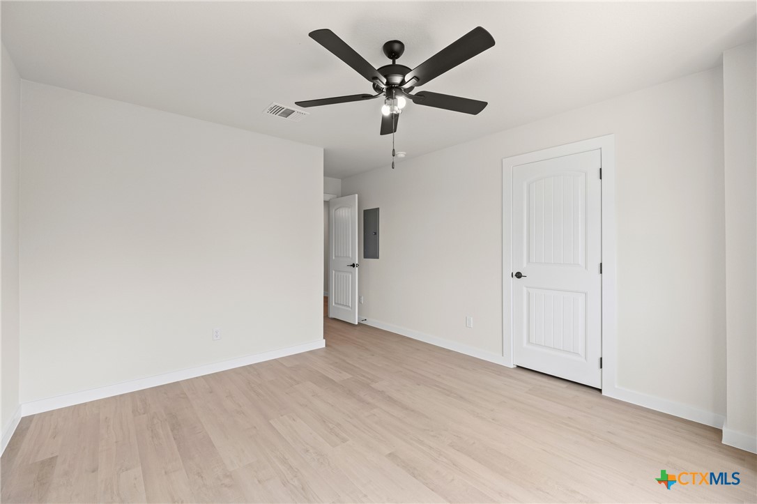 1204 Martin Luther King Jr Lane, Unit A Temple, TX 76504 - Photo 18 of 21 wooden floor in an empty room