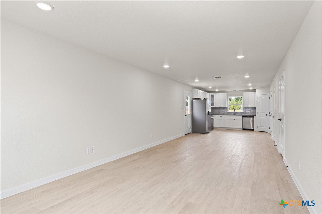 1204 Martin Luther King Jr Lane, Unit A Temple, TX 76504 - Photo 2 of 21 a view of a livingroom with a sink