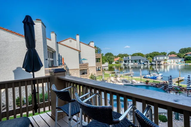 a view of a balcony with chairs