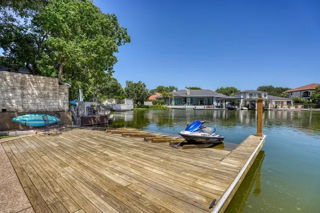 a small pool with tables and chairs