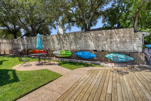 a view of a backyard with sitting area