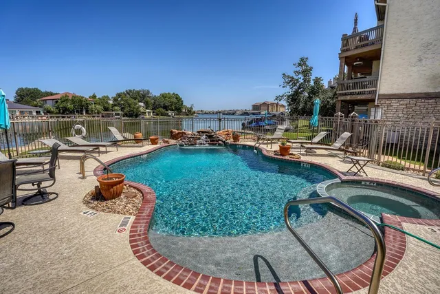 a view of a backyard with sitting area