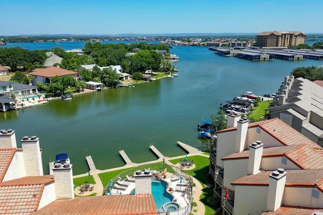 an aerial view of a house with a ocean view