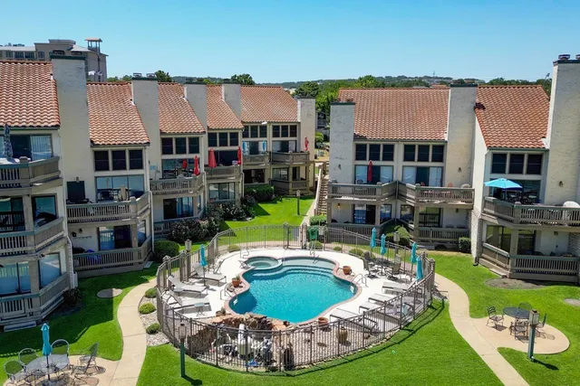 a aerial view of a house with swimming pool and sitting space