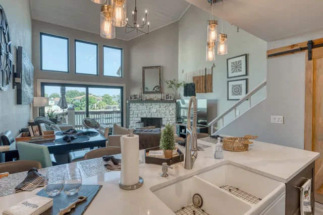 a work room with furniture and a chandelier