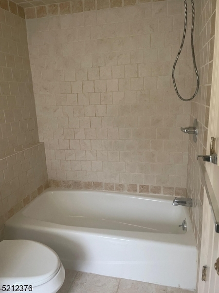 273 Edwards Street Ridgewood, NJ 07450 - Photo 18 of 26 a bathroom with a toilet and a bath tub