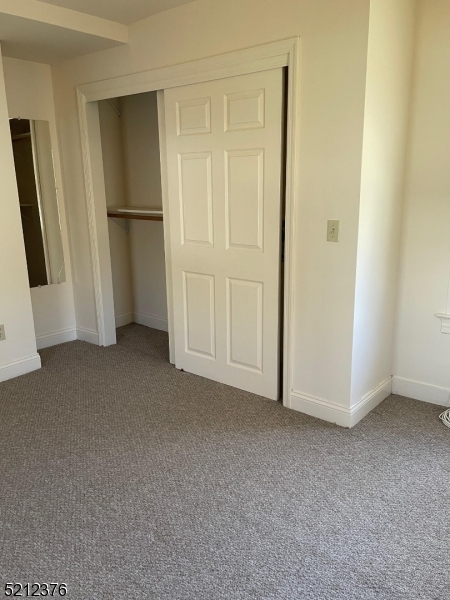 273 Edwards Street Ridgewood, NJ 07450 - Photo 22 of 26 a view of empty room with refrigerator and white cabinet