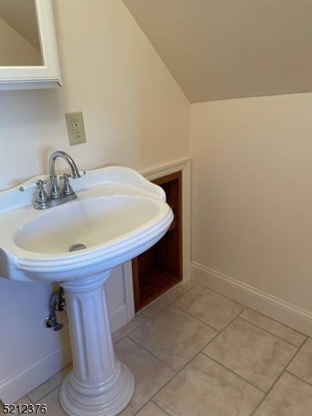 273 Edwards Street Ridgewood, NJ 07450 - Photo 24 of 26 a bathroom with a sink and a mirror