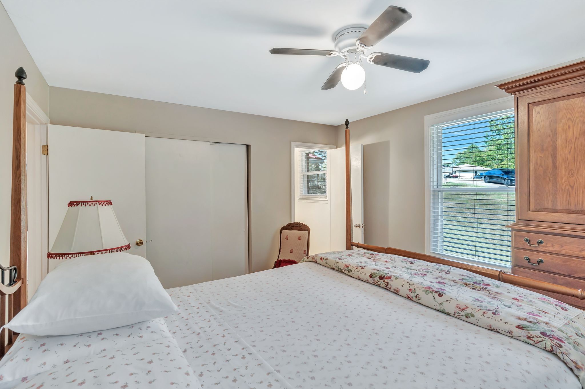 1008 Allen Road Ashland City, TN 37015 - Photo 19 of 26 a bedroom with a large bed and a chandelier