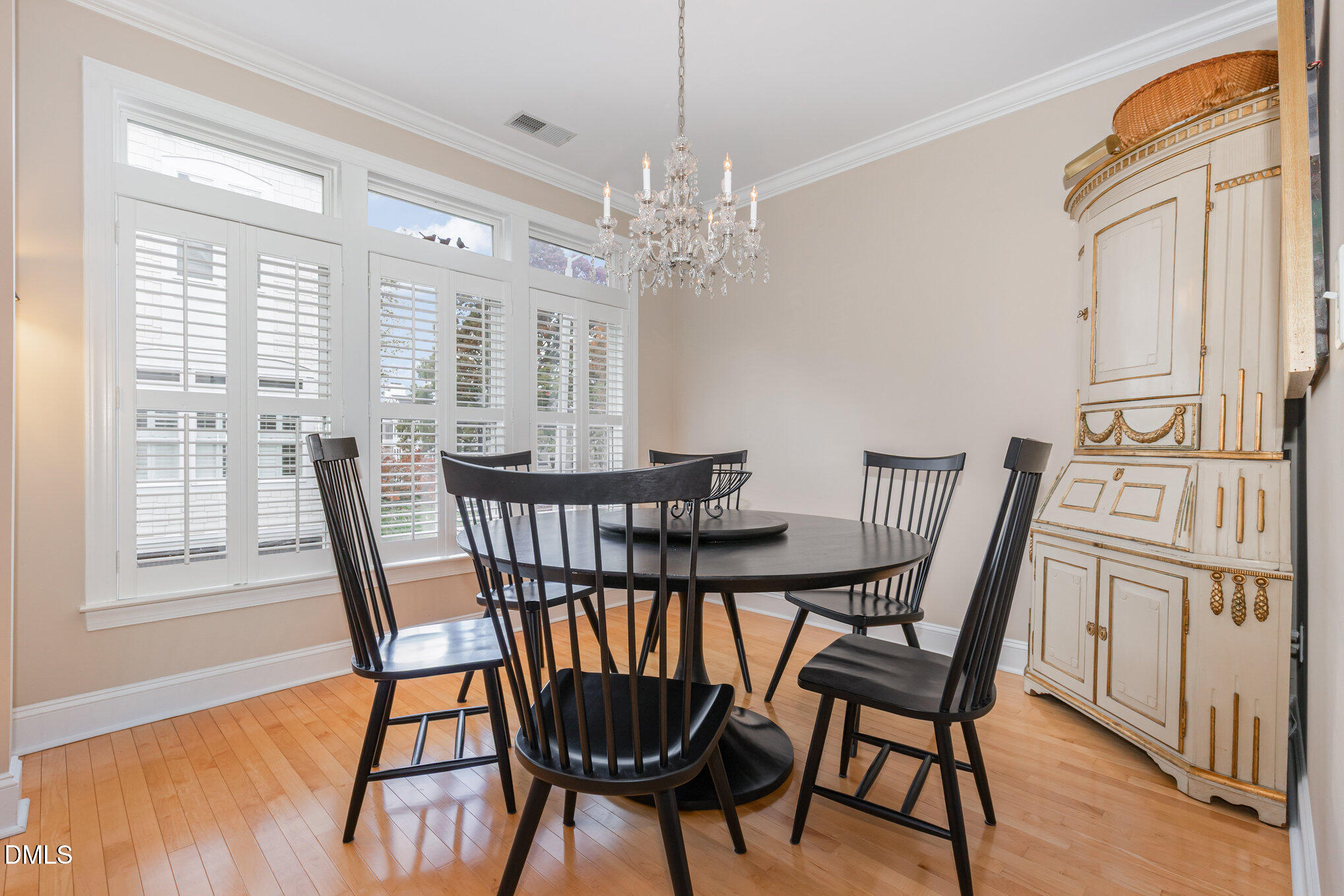 1120 Parkridge Lane, Unit 102 Raleigh, NC 27605 - Photo 12 of 50 a view of a dining room with furniture window and wooden floor