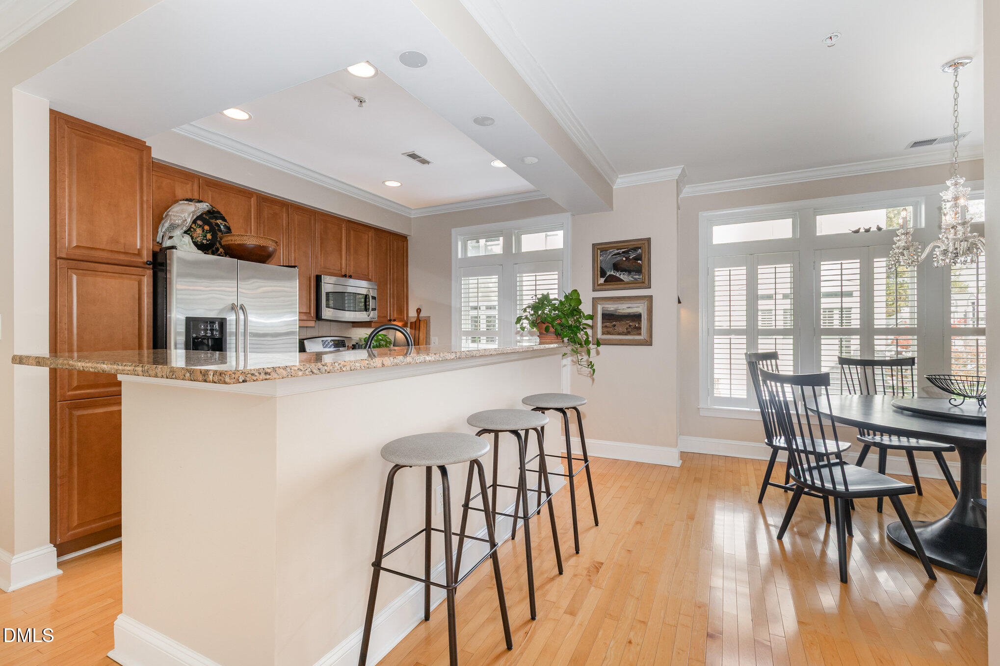 1120 Parkridge Lane, Unit 102 Raleigh, NC 27605 - Photo 14 of 50 a dining room with furniture and wooden floor