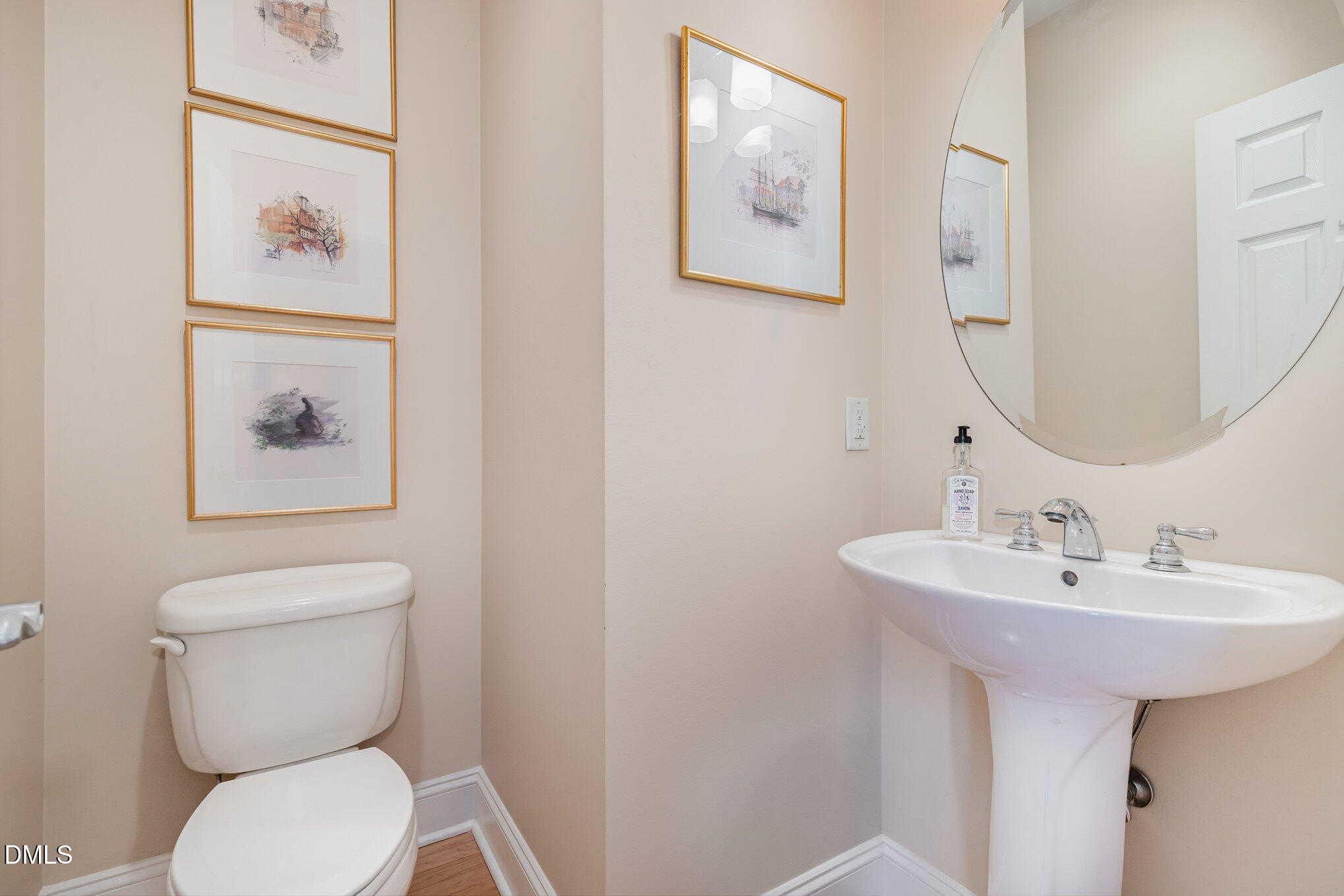 1120 Parkridge Lane, Unit 102 Raleigh, NC 27605 - Photo 21 of 50 a bathroom with a toilet a sink and mirror