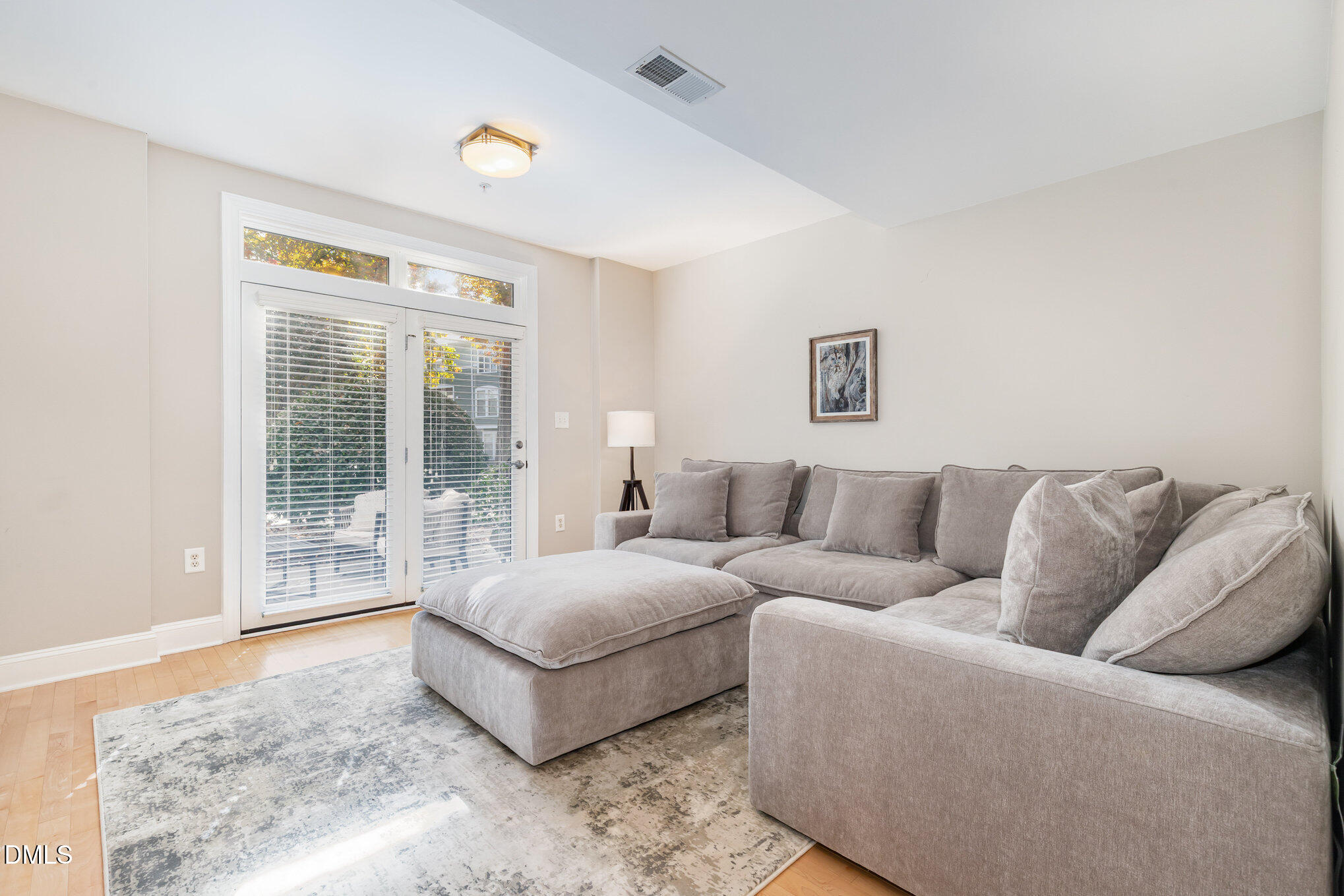 1120 Parkridge Lane, Unit 102 Raleigh, NC 27605 - Photo 22 of 50 a living room with a bed and a couch