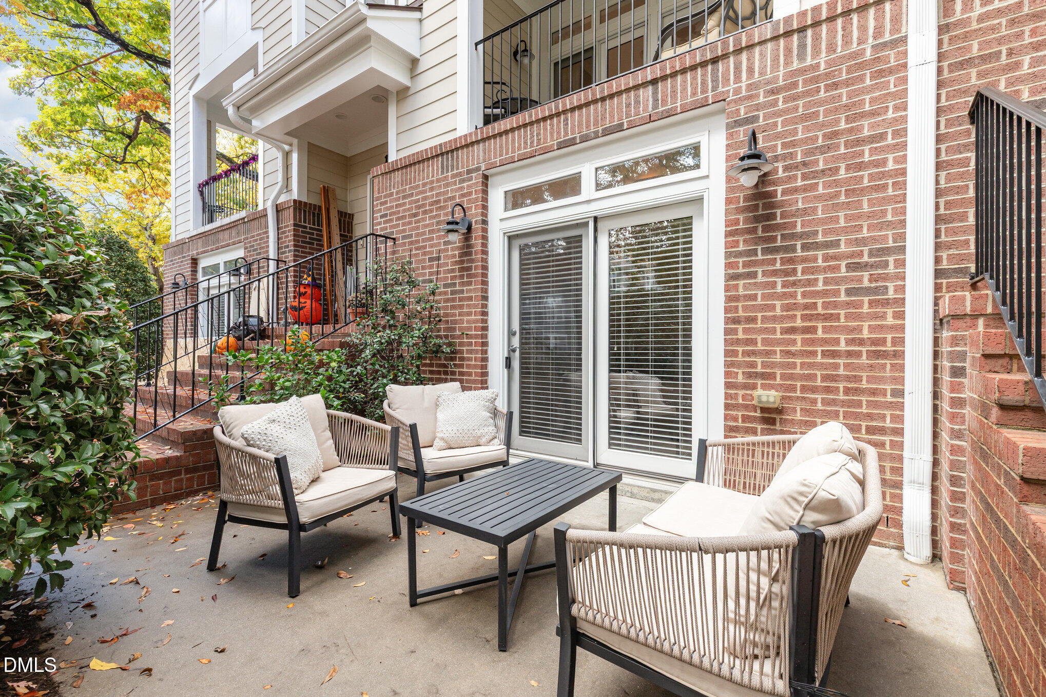 1120 Parkridge Lane, Unit 102 Raleigh, NC 27605 - Photo 24 of 50 a view of a chair and table in the balcony