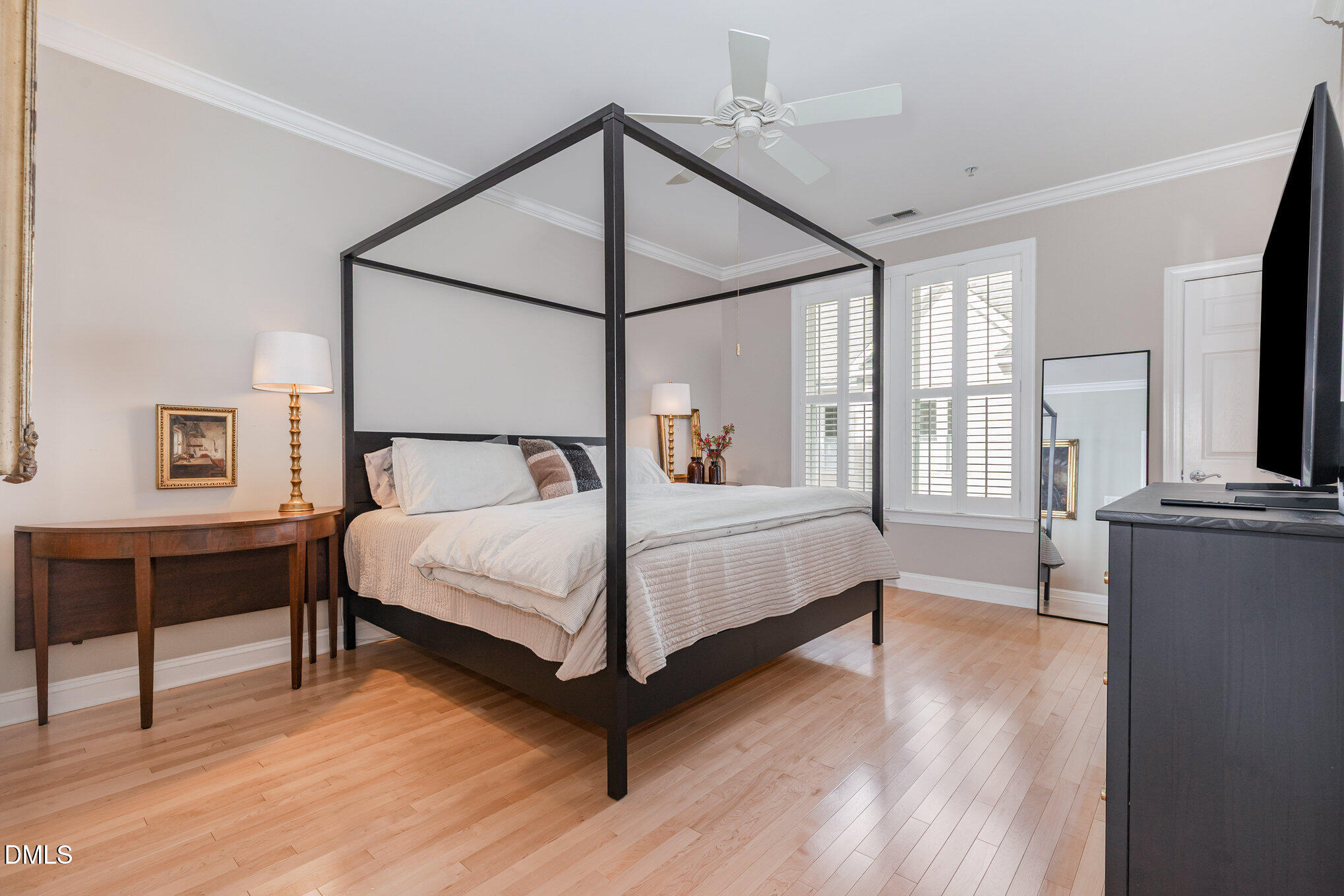 1120 Parkridge Lane, Unit 102 Raleigh, NC 27605 - Photo 26 of 50 a bedroom with a bed and a flat screen tv