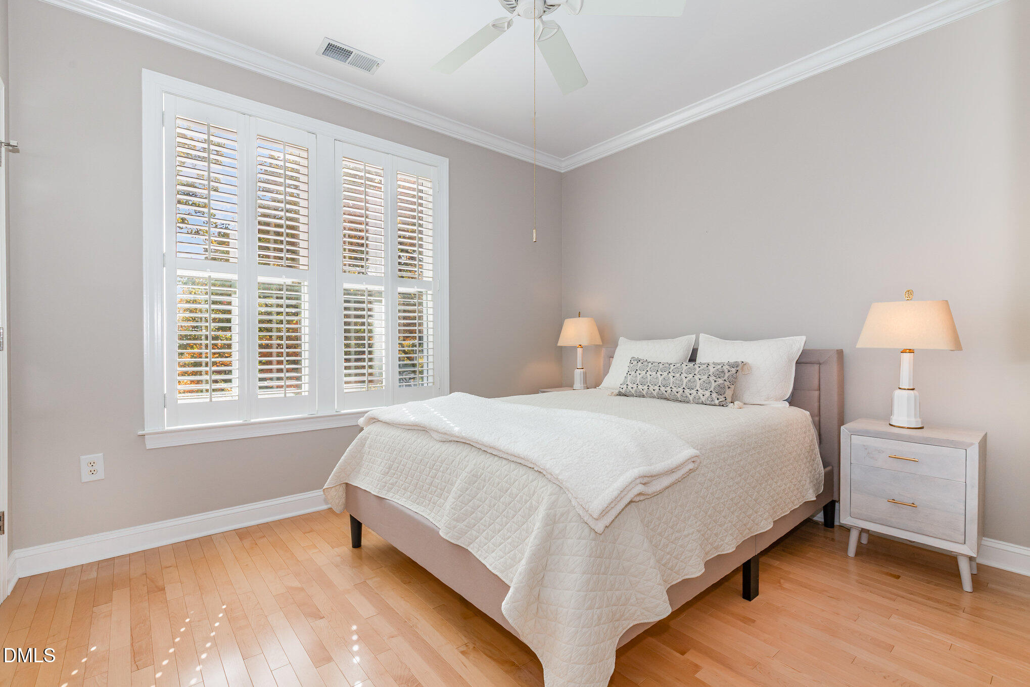 1120 Parkridge Lane, Unit 102 Raleigh, NC 27605 - Photo 30 of 50 a bedroom with a bed and a window