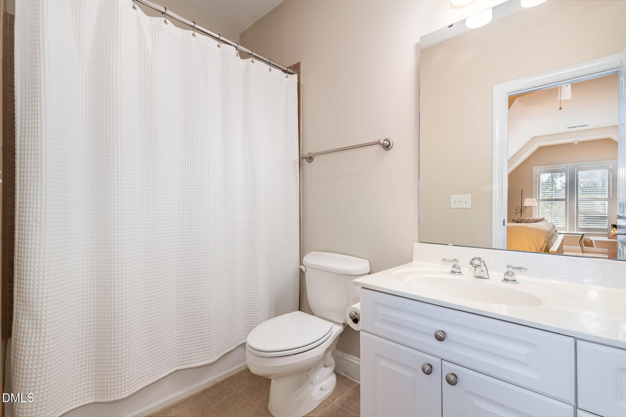 1120 Parkridge Lane, Unit 102 Raleigh, NC 27605 - Photo 37 of 50 a bathroom with a toilet a sink and a mirror