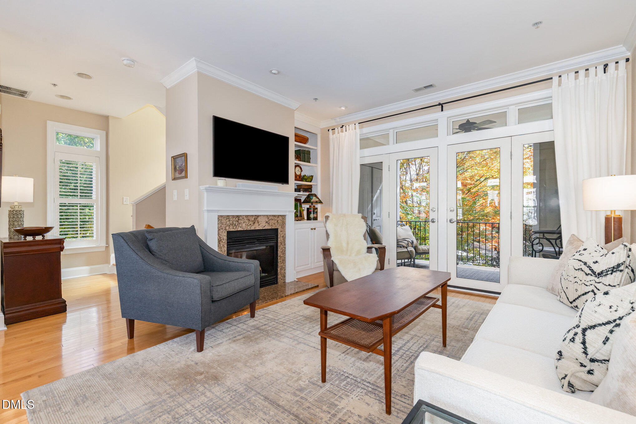 1120 Parkridge Lane, Unit 102 Raleigh, NC 27605 - Photo 5 of 50 a living room with furniture fireplace and a flat screen tv