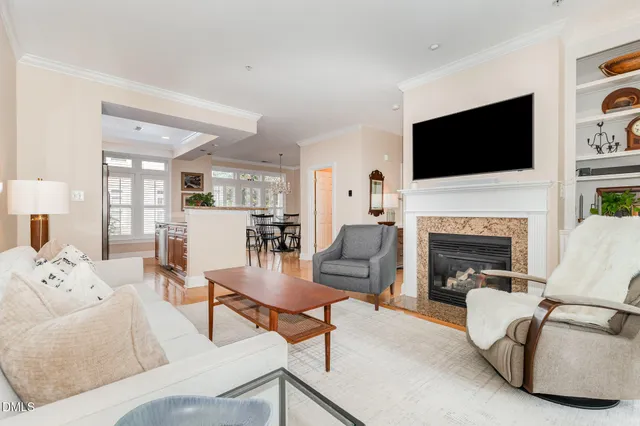 a living room with furniture fireplace and a flat screen tv