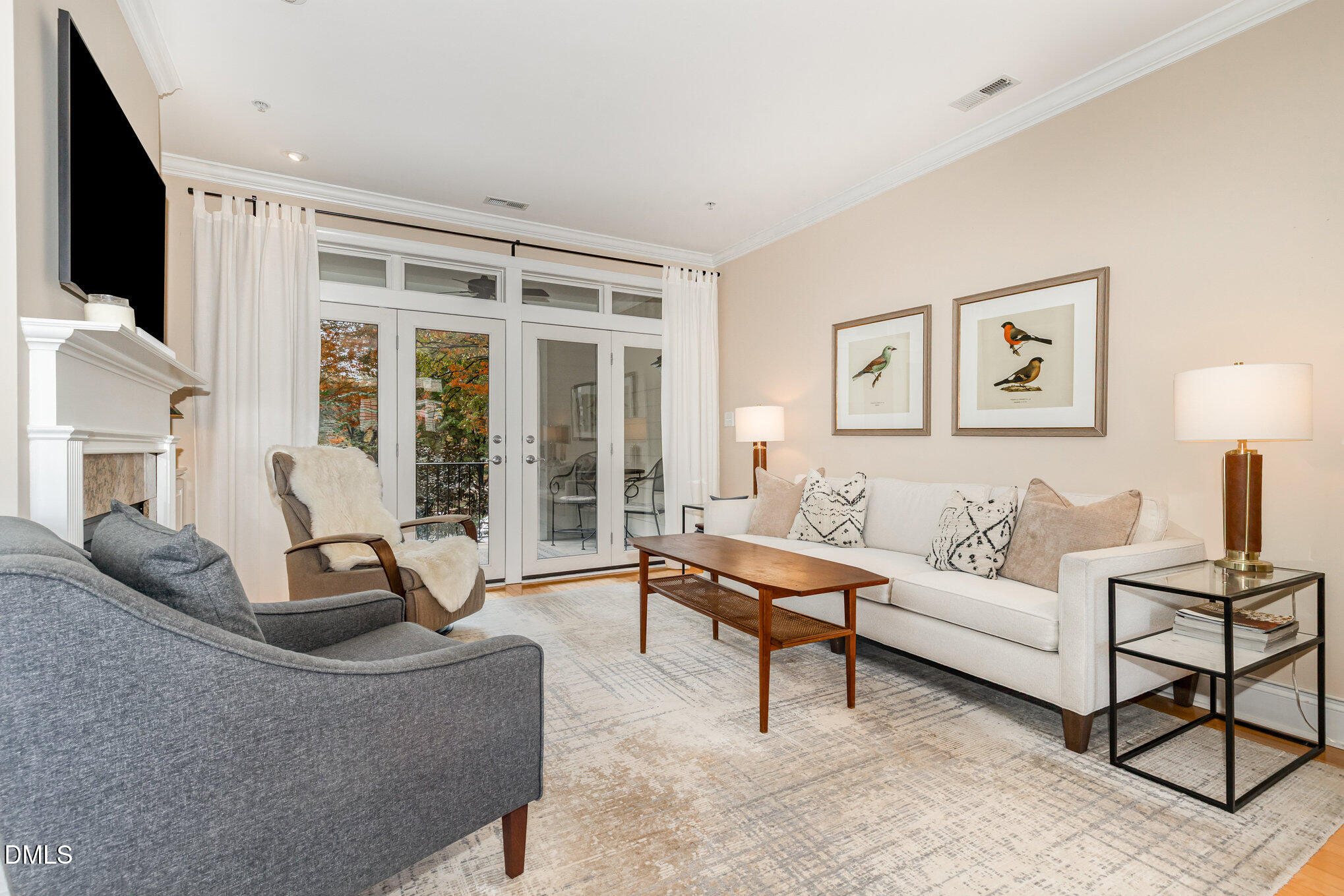 1120 Parkridge Lane, Unit 102 Raleigh, NC 27605 - Photo 10 of 50 a living room with furniture and a flat screen tv