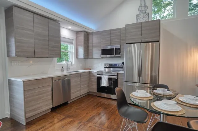 a view of a dining room with furniture and wooden floor