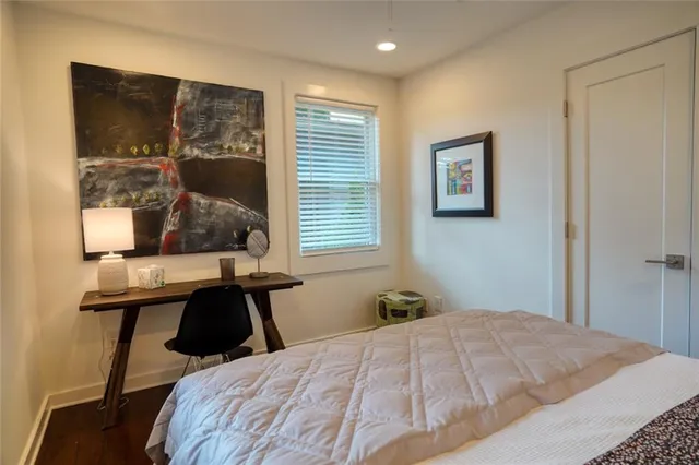 a bedroom with bed and a window