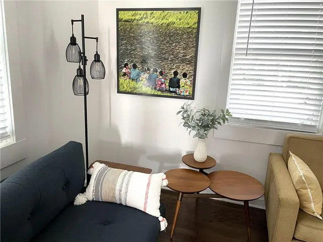 a living room with furniture and a window