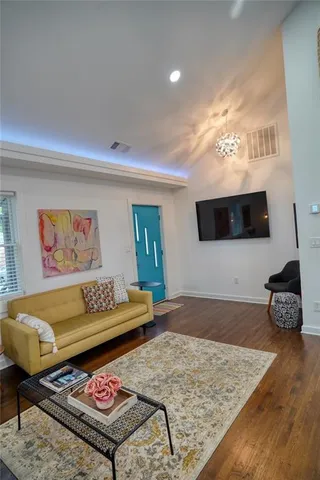 a living room with furniture and a rug