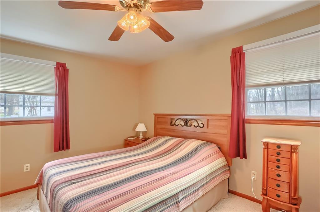2702 Old Pittsburgh Road New Castle, PA 16101 - Photo 15 of 20 a bedroom with a bed and a large window