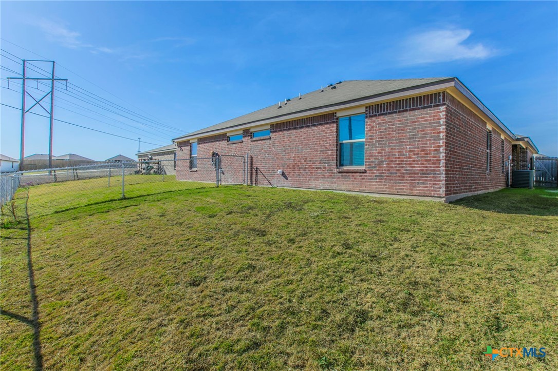 2416 Alterman Drive Temple, TX 76504 - Photo 11 of 15 a backyard of a house with lots of green space