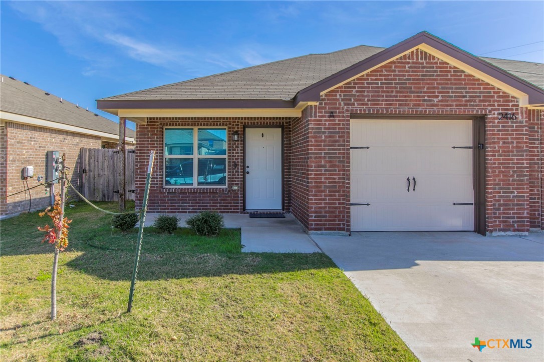 2416 Alterman Drive Temple, TX 76504 - Photo 2 of 15 a front view of a house with garden