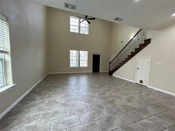 a view of an empty room with windows