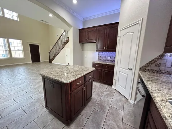 a kitchen with a stove a refrigerator and a sink